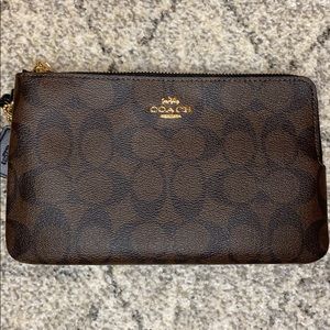 Double zipper coach clutch